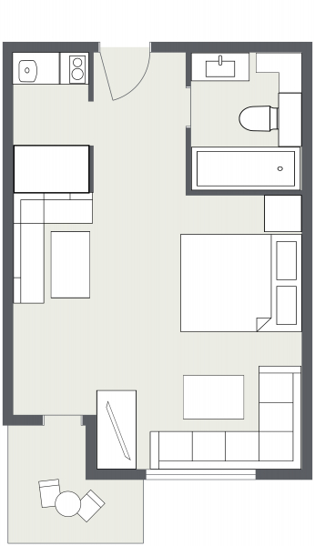 Einzimmerwohnung Samnaun Grundriss mit Bett, Küche, Bad, Wohnbereich und Balkon.