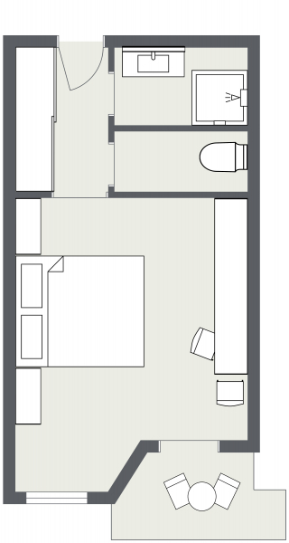 Studio-Apartment Grundriss wie ein Doppelzimmer Samnaun, mit Bett, Schreibtisch und Miniküche.