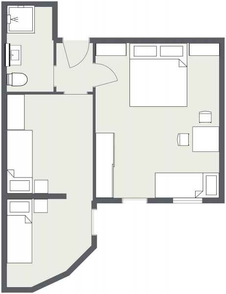 Schwarz-weißer Grundriss für Zimmer Samnaun mit zwei Schlafzimmern, Bad, Küche und Wohnbereich.