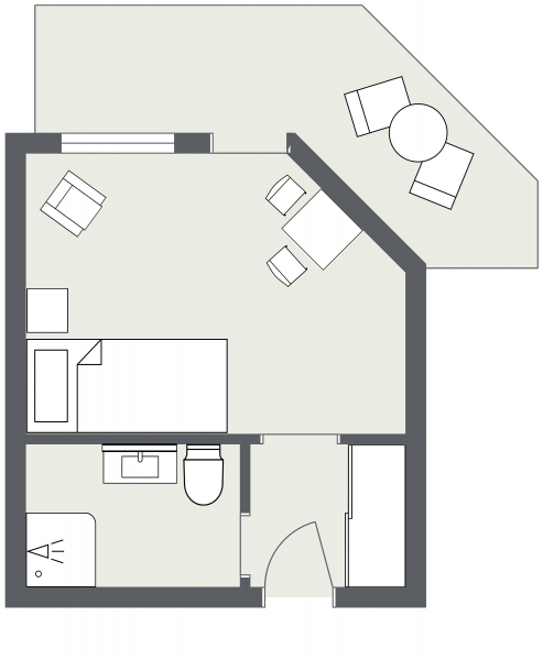 Einfaches Studio Zimmer Samnaun: Bett, Sitzecke, Schreibtisch, Bad und Balkon inklusive.