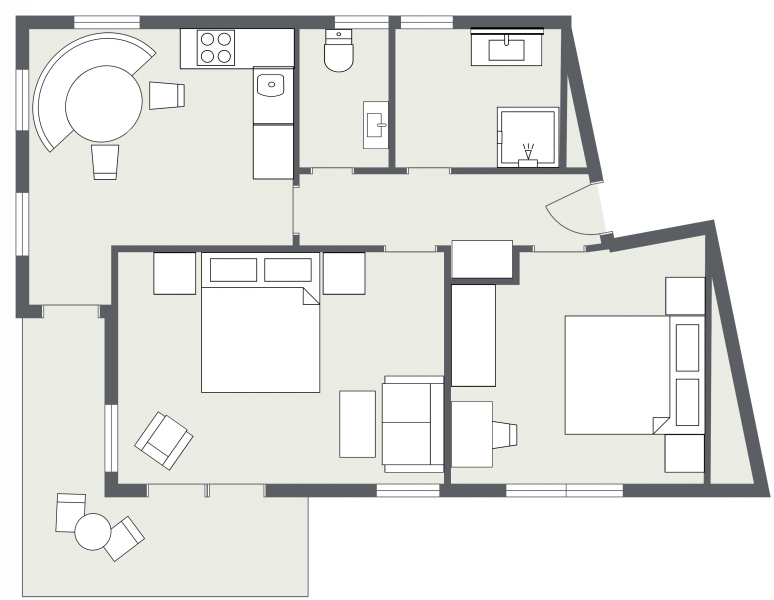 Schwarz-weißer Grundriss der Ferienwohnung Samnaun mit zwei Schlafzimmern, Küche und zwei Bädern.