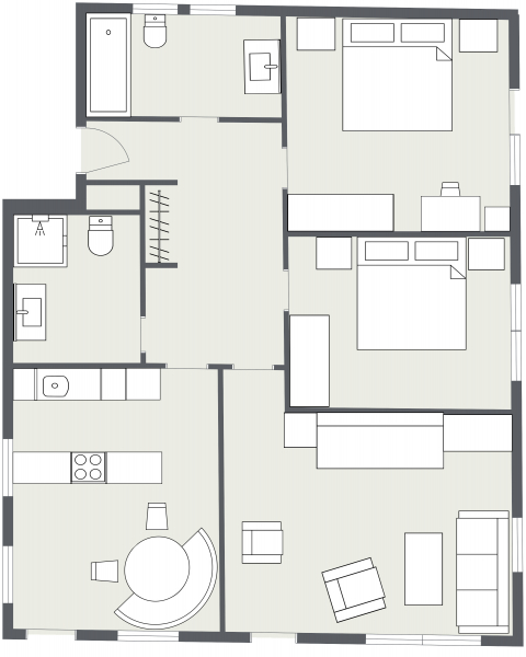Schwarz-weißer Grundriss der Ferienwohnung Samnaun mit zwei Schlafzimmern, Küche und zwei Bädern.